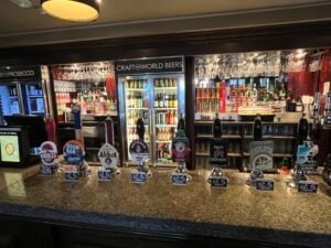 Spacious interior of The Earl Of Mercia Coventry with real ale pumps and Mercian-themed décor